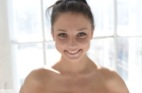 Sweet young Medina U kneel on a chair natural and flaunts her petite alluring curves