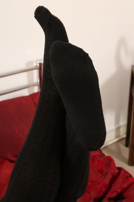 Attractive babe Kirstie Collins peels her gown & leather corset to tease in stockings