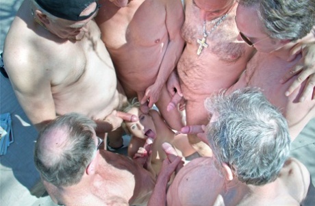 Alluring ten girl volunteers for a gangbang and blowbang with old men