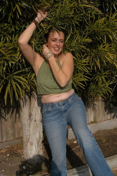 Alluring big boobed MATURE WOMAN Katiana gets artistic in the garden and massages her clit