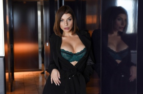 Brunette chick covers up her natural breasts in front of a Priest