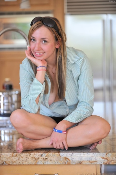 Girl next door type toys her landing strip femininity on the kitchen counter