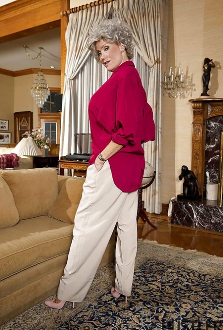 Granny pornstar Darla Crane stripping down to bra and underwear