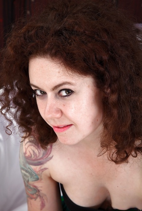 MATURE WOMAN with hairy femininity pulls down her panties and stretches her gaping twat