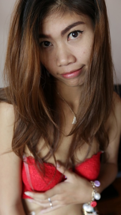 Asian babe Nam C shows off her petite body while stripping for some POV intimacy