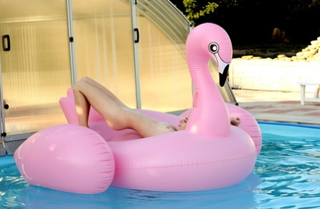 Lovely young adult Shayla shows every inch of her petite natural body outdoors