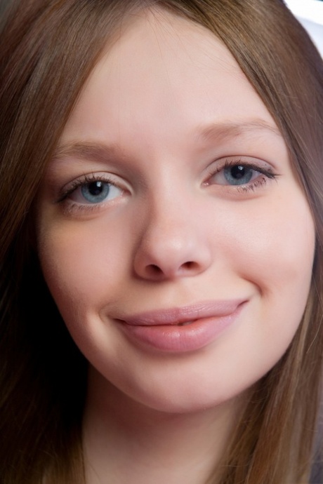 Pretty eyed young adult Kylie A teases with her slim figure in pink stockings