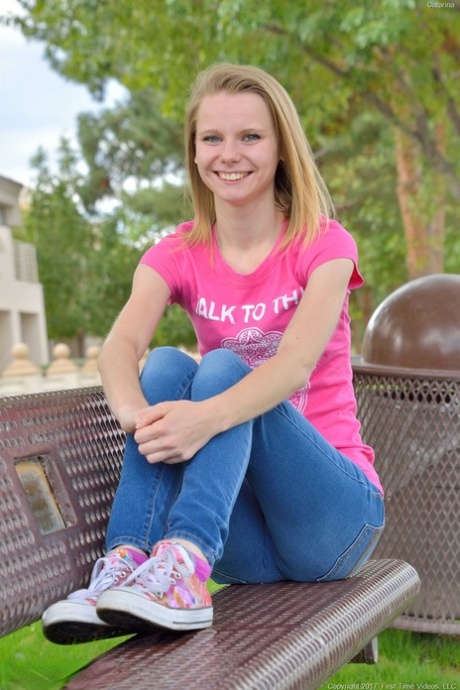 Sweet skinny young adult Catarina unveils her tiny breasts and tasty clam at the park