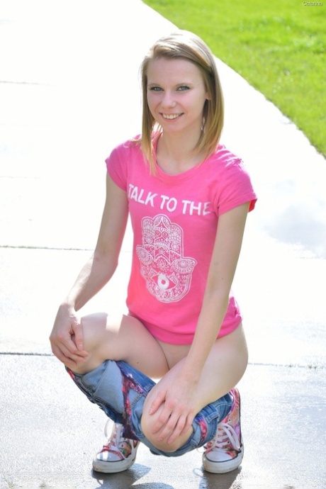 Sweet skinny young adult Catarina unveils her tiny breasts and tasty clam at the park