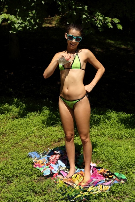 Alluring petite authentic Alaina Kristar undresses and spreads her twat outdoors