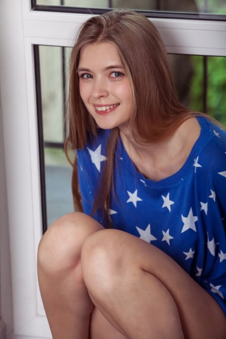 Alluring young adult Sigrid shows her alluring curves and her lickable shaved femininity