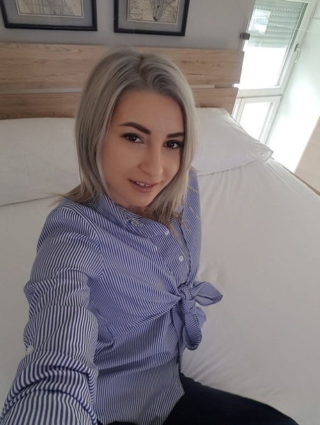 Attractive young adult with a small bosom Ari Fox undresses and poses artistic at her home