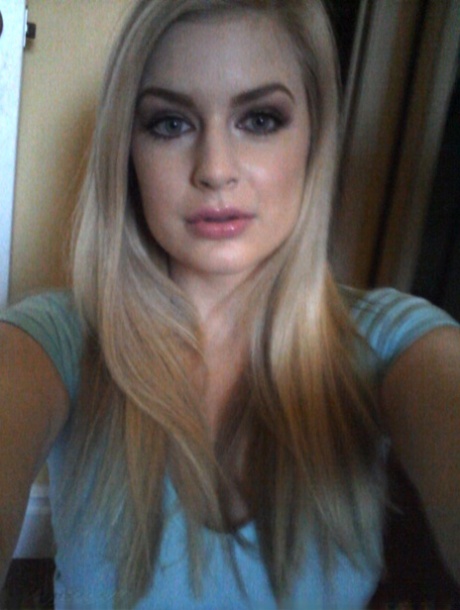 Blonde authentic Danielle takes artistic selfies during candid action