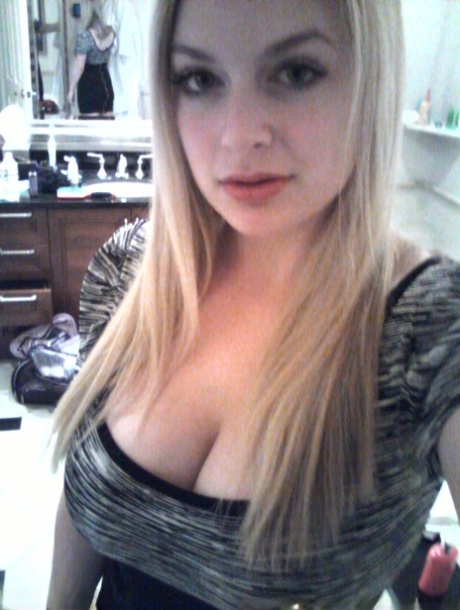 Blonde authentic Danielle takes artistic selfies during candid action