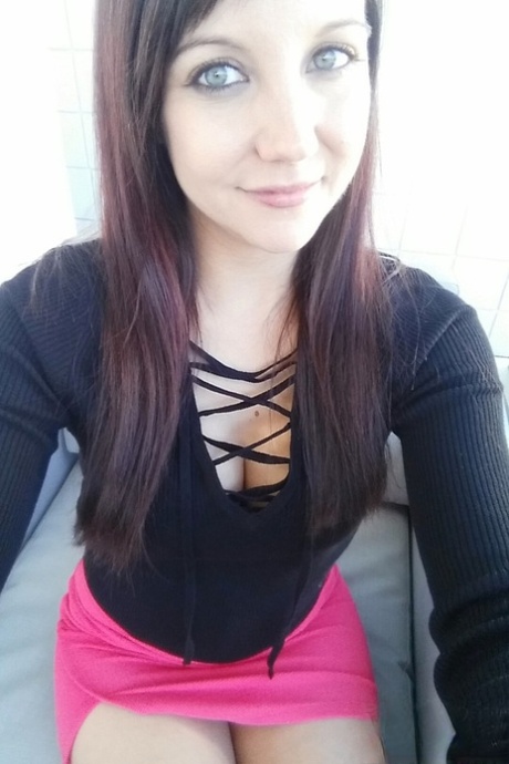 Slim young adult Andi Land takes candid artistic and clothed selfies while at home