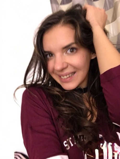 Russian young adult Alina Henessy takes artistic and non artistic selfies during the day