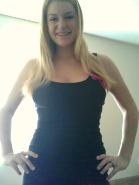 Blonde girl takes non artistic selfies in various places around her house