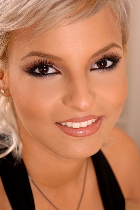 Stunning blonde beauty fondles perfect breasts and show bare femininity close up