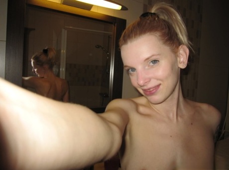 Skinny authentic shows her sweet breasts while taking artistic selfies in the mirror
