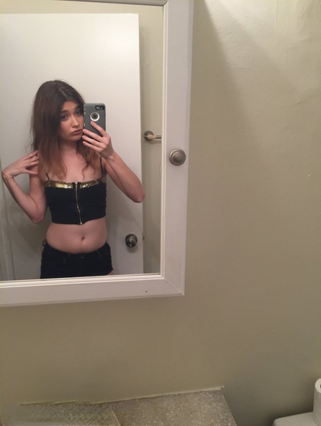 Petite young adult Ariel Mc Gwire makes her artistic modeling debut in bathroom selfies