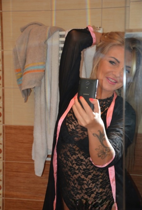 Blonde authentic takes artistic selfies showing her tiny breasts & her bald cunt