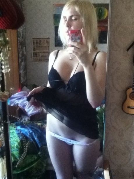 Blonde authentic takes alluring artistic selfies while trying on various outfits