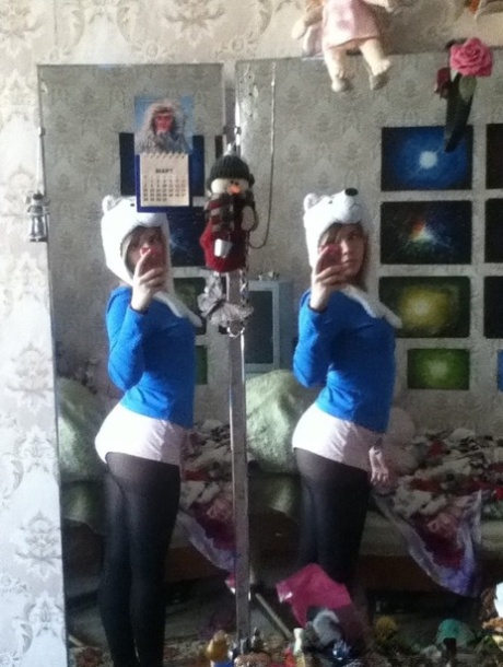 Blonde authentic takes alluring artistic selfies while trying on various outfits