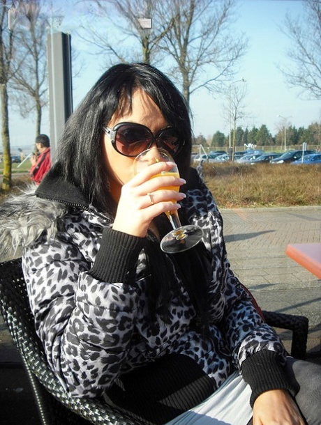 Dark haired authentic goes natural in a car before giving a oral pleasure in public