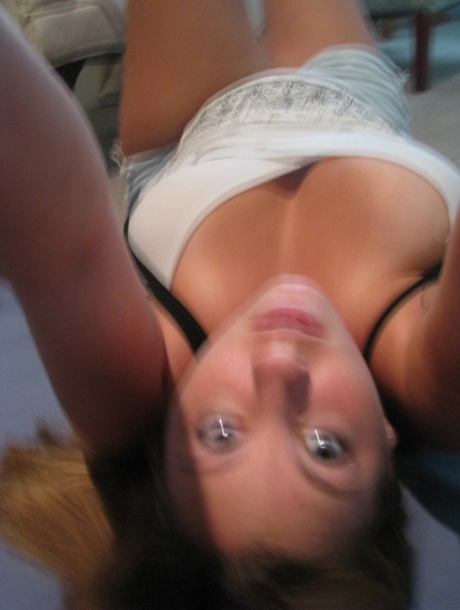 Dirty authentic young adult Nikki Morgan flaunts her cleavage in intimacy self shot photos