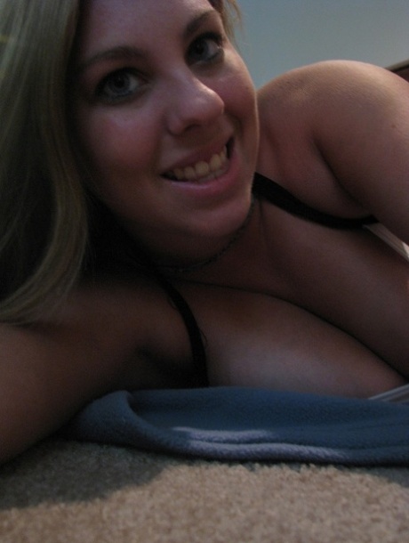 Dirty authentic young adult Nikki Morgan flaunts her cleavage in intimacy self shot photos