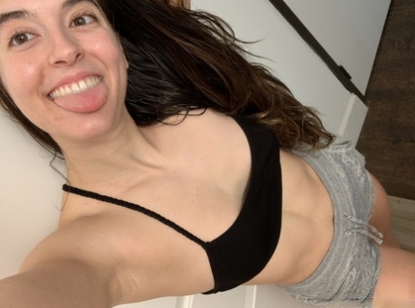 Authentic model holds her bare curves during a series of artistic selfies