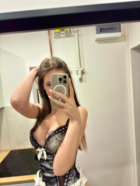 Pretty OnlyFans cam babe shows off her breasts wearing alluring lingerie