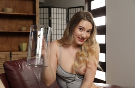 Naughty blonde Sunshine toys with a big dildo in a sizzling piss play solo