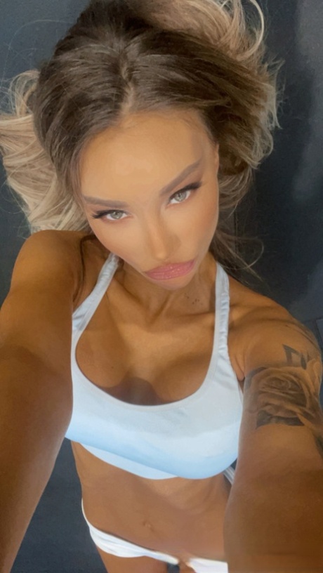 Petite babe Monika Fox shows off her big boobs with pierced nipples at the gym