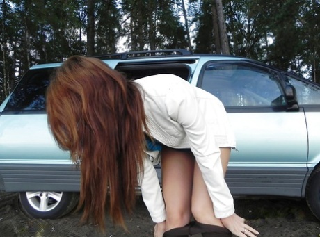 Pretty brunette slut with cute ass and tits is undressing outdoor