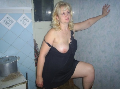 Chubby mature lady shows off her beautiful medium tits & her trimmed pussy