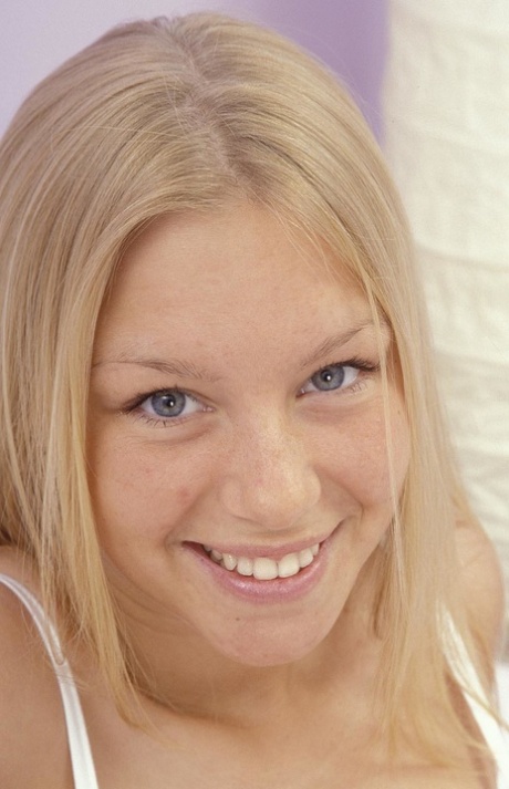 Breathtaking blonde Abi strips and touches huge natural tits and trimmed pussy