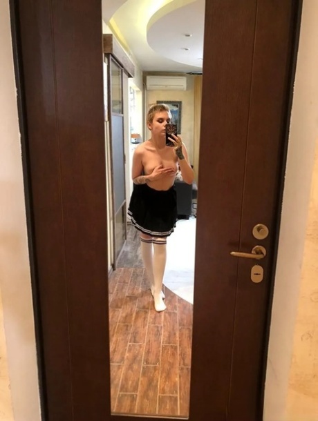 Sexy cheerleader takes nude selfies showing her small tits & her hot ass