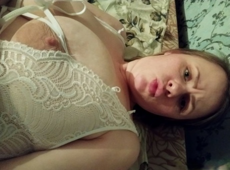 Naughty amateur flaunts her incredible big tits and nice ass in lingerie