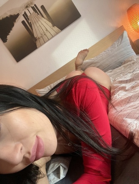 Dark-haired amateur Sasha Sparrow takes selfies of her big booty as she strips