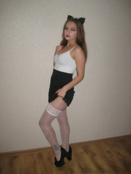 Barely-legal girlfriend strips to her stockings & shows her boobs & ass