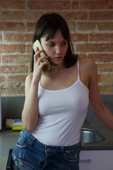 Foxy young adult Lara Maiser revealing her alluring body and sensitive tattooed feet