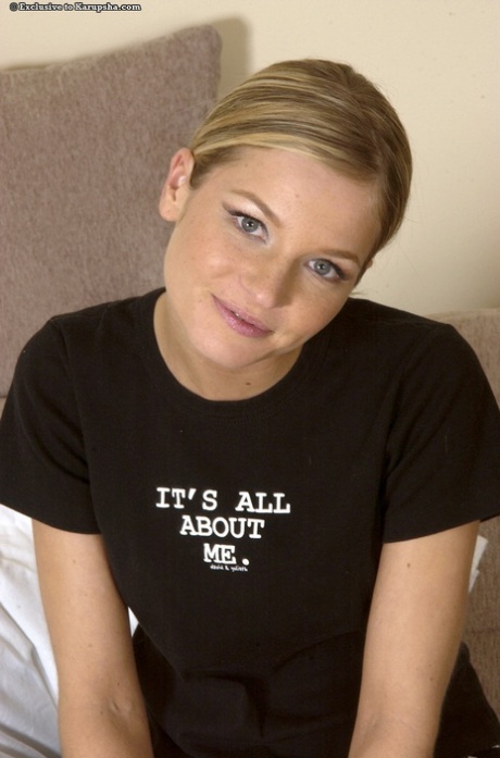 Authentic attractive young adult with alluring feet spreading her legs to show off her bald cunt