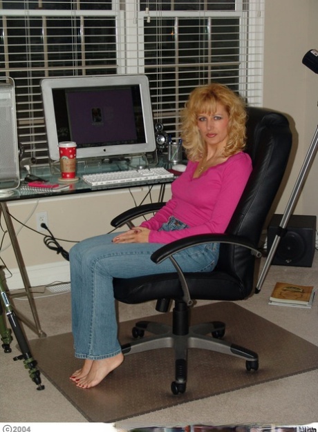 Horny mature Racquel Devonshire talks on the phone while taking a shot of cum