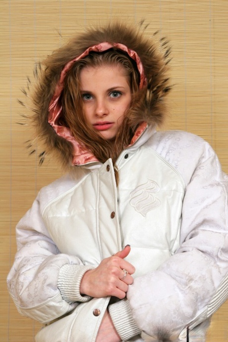 Skinny babe Lil Candy shows her tiny boobs while posing in her winter jacket