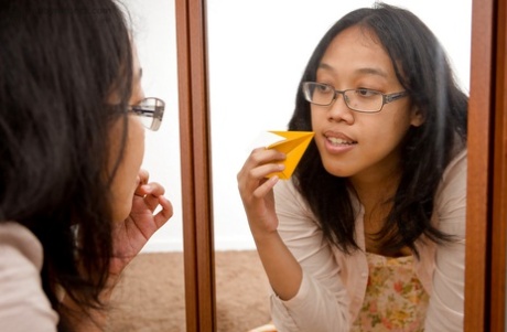 Young Asian authentic Thea stripping and spreading her wet femininity