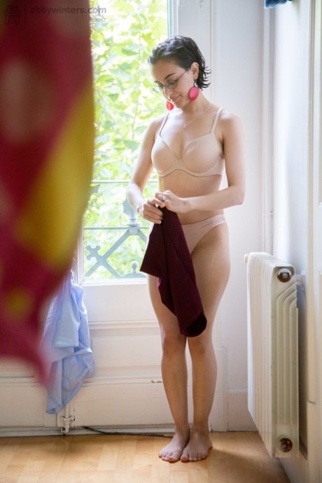 Natural female covers her hairy bush with panties as she gets dressed