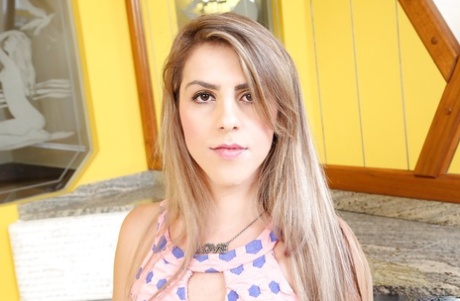 Beautiful young adult shemale Raissa Angel posing seductively in mini skirt