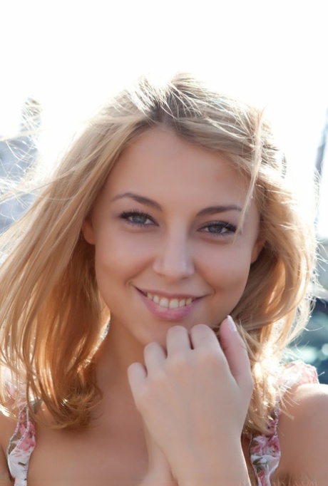 Sweet Nikia A doffs her sun dress to show perky small breasts & attractive shaved muff