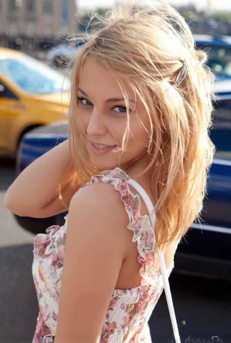 Sweet Nikia A doffs her sun dress to show perky small breasts & attractive shaved muff